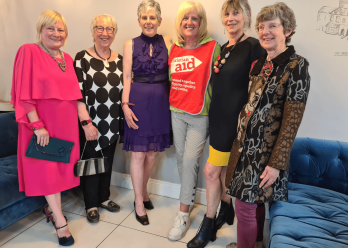 Women enjoying pre-loved fasion show, Belfast