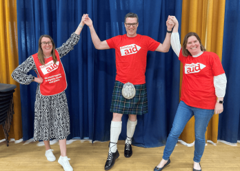 Joining hands at a ceillidh in Bangor